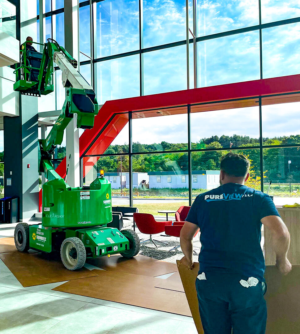 A worker working from a raised lift