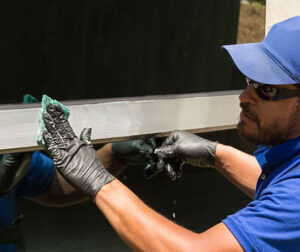 A worker polishing metal