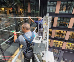 Workers cleaning windows